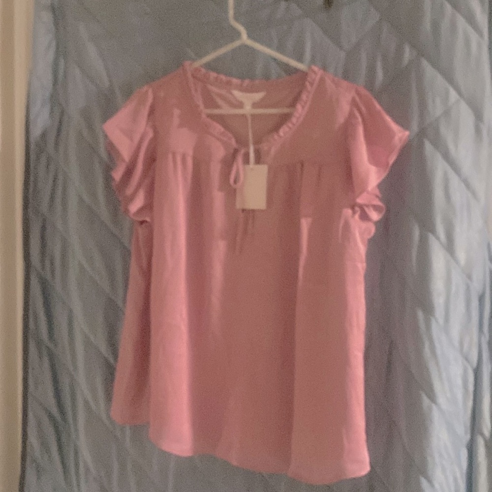 Large, dusty rose, ruffled, short sleeve blouse with front string tie.